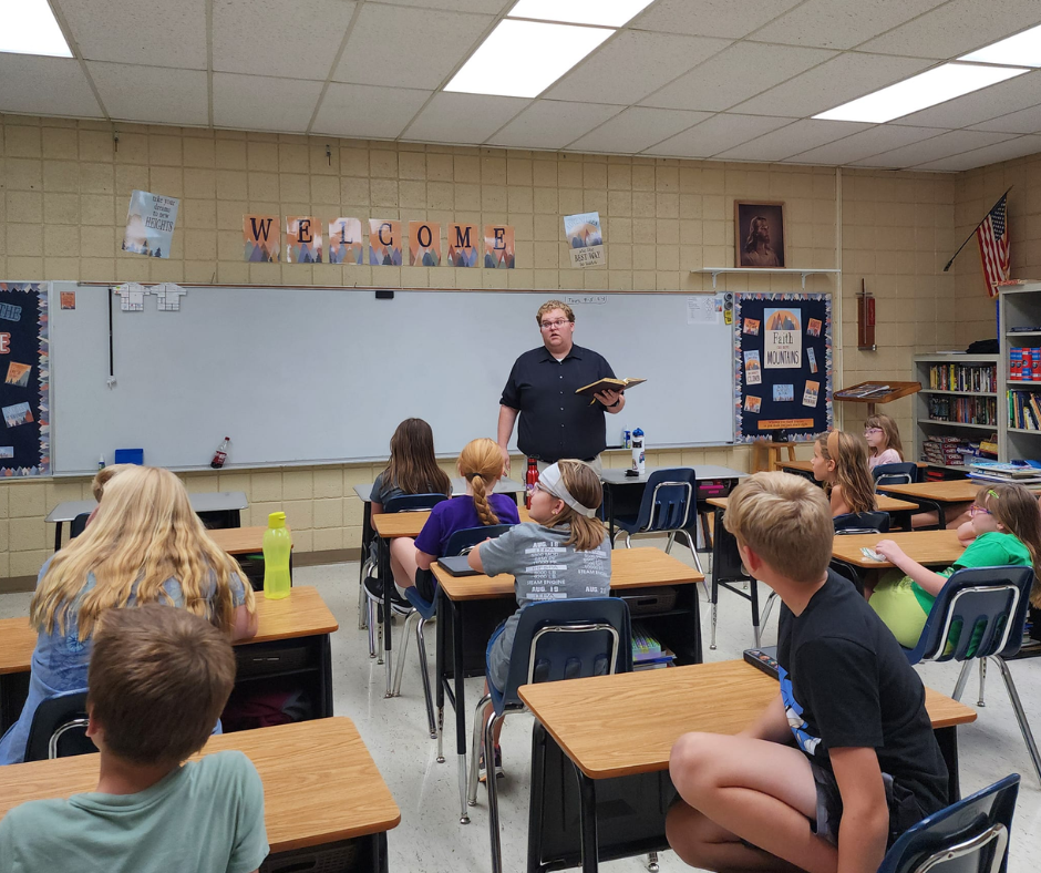 k-8 grade person raising hand